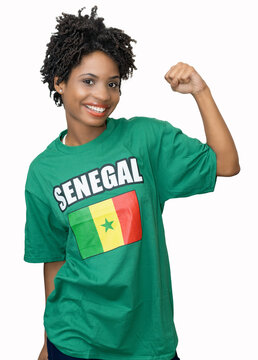Young female football fan from Senegal with green jersey