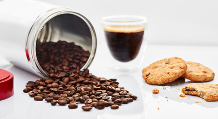 cup of coffee with beans and biscuit