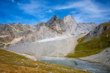 Fototapeta na wymiar Long lake and Grande Casse Alpine glacier in French alps