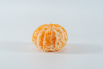 Peeled Tangerine on white background