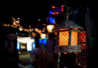 Close-up shot of an illuminated bamboo lamp in the dim lighting