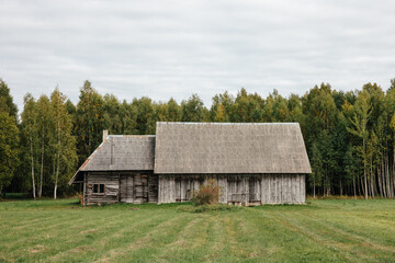 Fototapeta na wymiar Typical old Latvian barn in the Latvian countryside