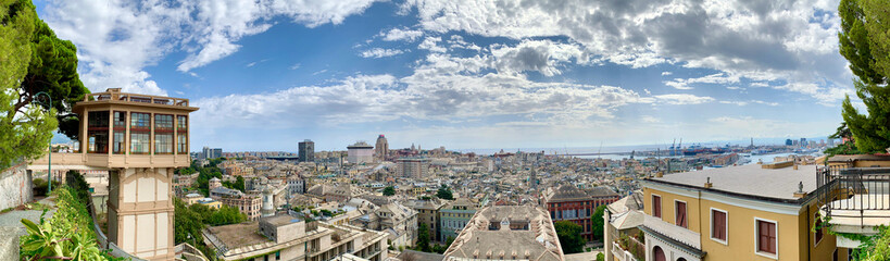 Fototapeta na wymiar Genoa city panorama with Castelletto Art Nouveau lift with wide-angle view of old city and port