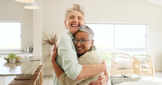 Hug, visit and woman with senior friends in a retirement home with love, affection or excitement. Friendship, happy and hug with a mature female and friend bonding in the living room of a house