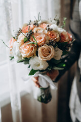 Wedding flowers, bridal bouquet closeup. Decoration made of roses, peonies and decorative plants, close-up, selective focus, nobody, objects