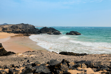 Fototapeta na wymiar Sea wave blue sky in Masirah island,Oman