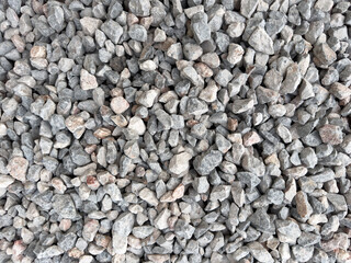 Isolated many crushed stone ground floor background. Granite gravel texture