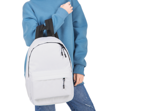 a girl dressed in a hoodie holds a backpack in her hands, isolated
