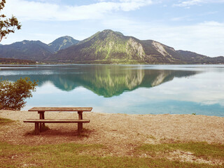 Wooden table and bench on Walchensee lake built as tourist break plac