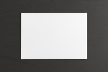 Blank sheet of paper mock up on the black background.