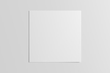 Square sheet of paper on the white table.
