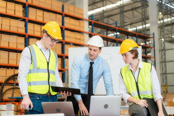 Team of factory workers or technicians celebrate the success together. Collective appreciation and team effort in a factory. Leadership in teamwork