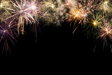 Colored fireworks on black background copy space