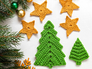 Festive Christmas composition with crochet green Christmas tree and yellow stars. Handmade...