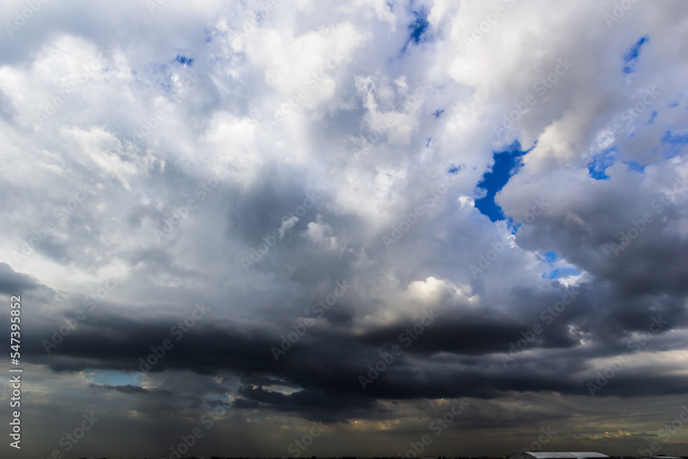 Poster the dark sky with heavy clouds converging and a violent storm before the rain.bad or moody weather s