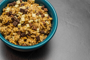 Healthy homemade muesli in a blue bowl