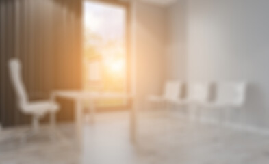 Modern office building interior. 3D rendering.. Sunset.. Abstract blur phototography.