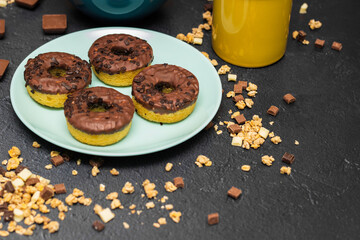 Chocolate granola muesli with chocolate milk,almonds, hazelnuts  and doughnuts