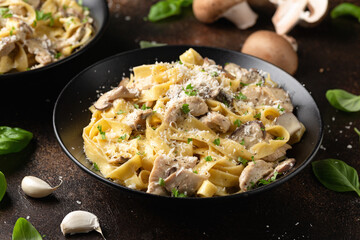 Creamy Alfredo pasta with chicken, mushrooms and parmesan cheese. Healthy Italian food