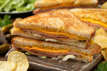 Fried Bologna Sandwich with Cheese and iceberg lettuce © grinchh
