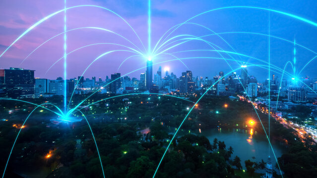 Smart digital city with connection network reciprocity over the cityscape . Concept of future smart wireless digital city and social media networking systems that connects people within the city .