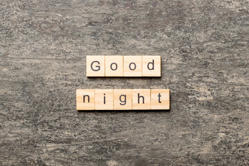 good night word written on wood block. good night text on table, concept