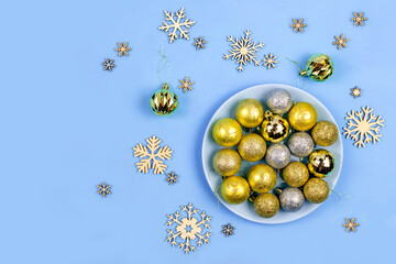 Festive composition. Golden balls and snowflakes.christmas background with decorations, flat lay,Copy space