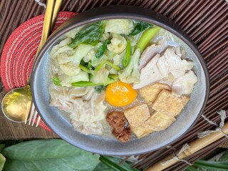 Soup in gravy with yolk, tofu and vegetable