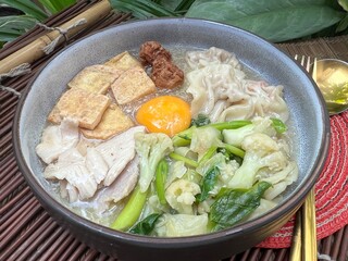 Soup in gravy with yolk, tofu and vegetable