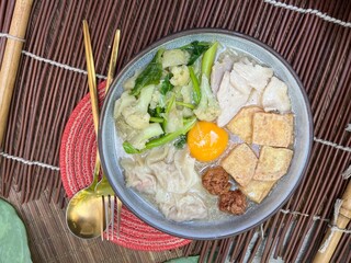 Soup in gravy with yolk, tofu and vegetable