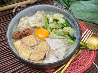 Soup in gravy with yolk, tofu and vegetable