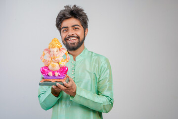 Young Indian man with Lord Ganesha , Celebrating Ganesha festival