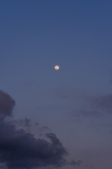 Full moon and clouds in the sky. Panorama. Background.