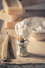 Antique and traditional barber equipment with razor and soap.