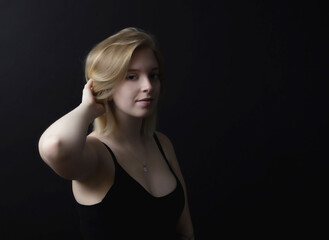 Low key  portrait of young woman. Horizontally.