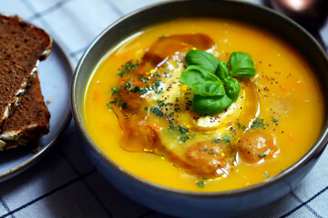Pumpkin carrot soup with meatballs in a bowl. Autumn menu.