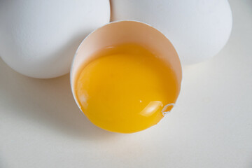 Eggs and egg yolk in shell isolate on white background