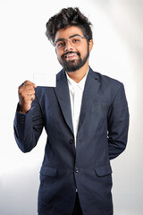 young indian Business man handing a blank business card Isolated on white.