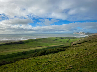 Fototapeta na wymiar UK green landscape with sea and clouds