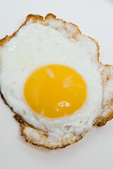 Fried egg isolate on white background. Concept of high prices for eggs and food. Concept of healthy eating