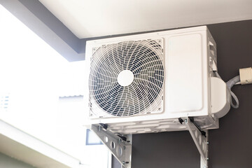 Condensing unit of air conditioning system mounted on outdoor wall, air condensing unit, heat pump...