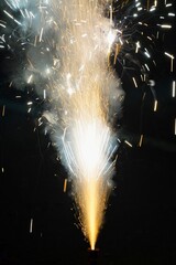 Fireworks in the night. Sparks at night. Indian festival of lights celebrated with exploding fireworks. Flower Pot cracker exploding on Diwali night.