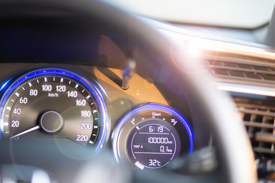 Car dashboard odometer showing 100,000 miles, car maintenance at 100,000 miles, important to replace when the maintenance interval specified in the car manual is reached.