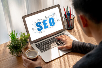 SEO search engine optimization for modish e-commerce and online retail business showing on computer...