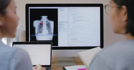 Big data AI coding screen for asian future health care smart tech IT solution. Asia team woman people code analyst job work on science project Lung X-ray scanner medtech tools meeting talk at office. - Powered by Adobe