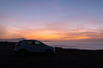 Fototapeta na wymiar Car by the Sea in Afterglow