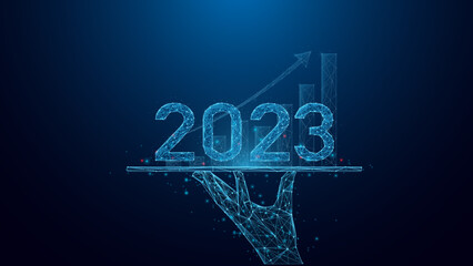 Hand holding tablet and showing holographic graphs and 2023  Concept of growth planning and business strategy with Abstract low poly wireframe style geometric on blue dark background.