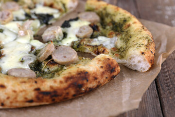 Neapolitan pizza with sausage and pesto