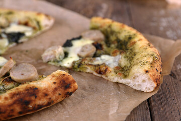 Neapolitan pizza with sausage and pesto
