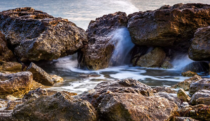 Naklejka na ściany i meble Scenic view of rocks in sea